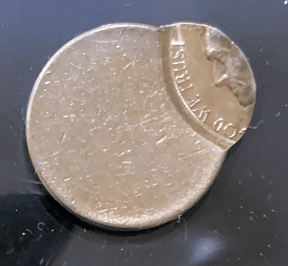 1951 Jefferson nickel off-center strike error showing design shifted and blank planchet crescent visible