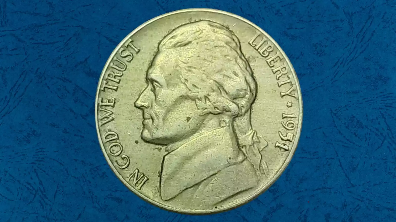1951 Jefferson nickel Filled In 5 die gouge error showing filled numeral 5 in FIVE CENTS inscription on reverse